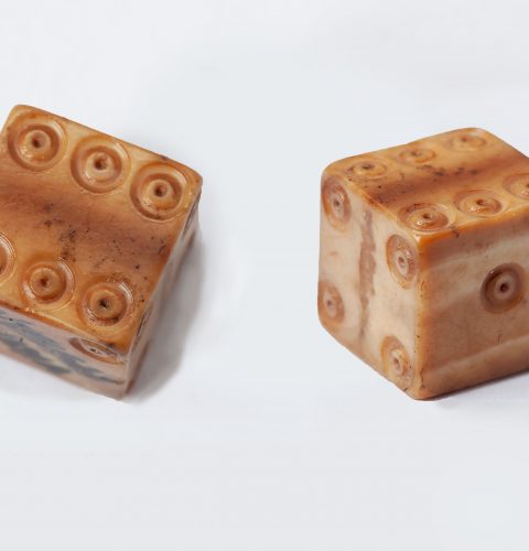 Rolling dice. 13th–15th cent. Bone.